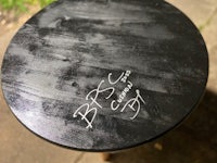 a black table with writing on it
